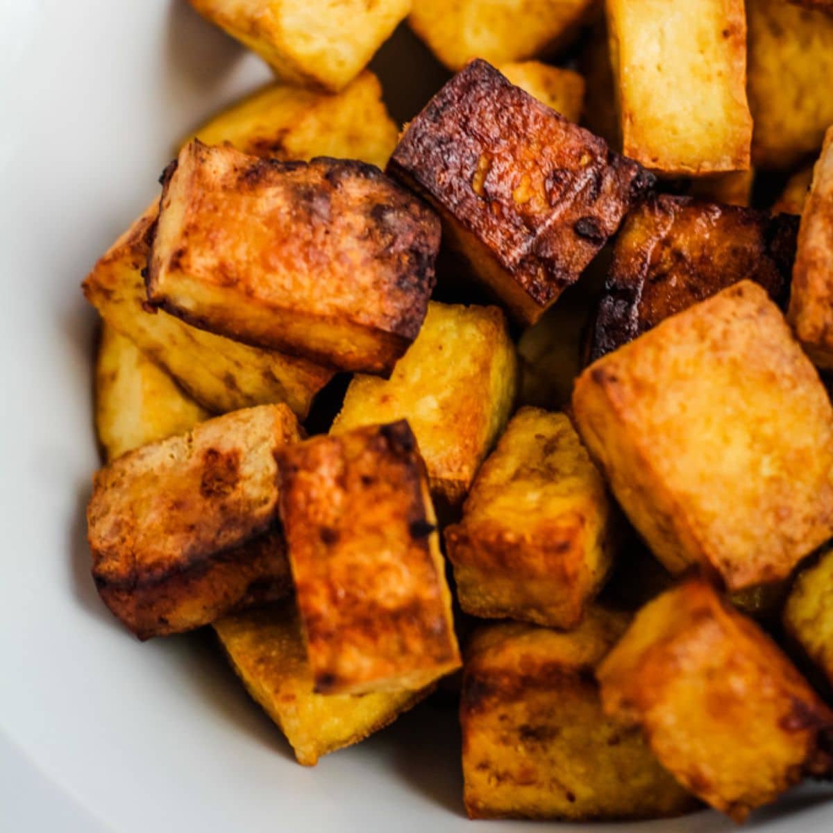 Spicy air fryer tofu cubes.