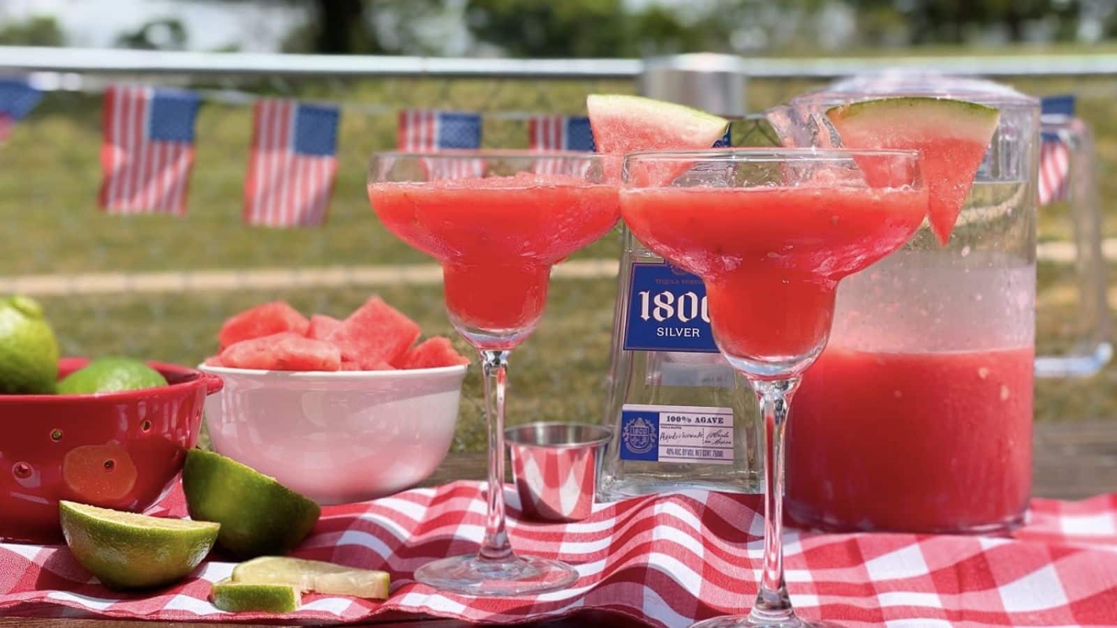 Watermelon margaritas on a picnic table.