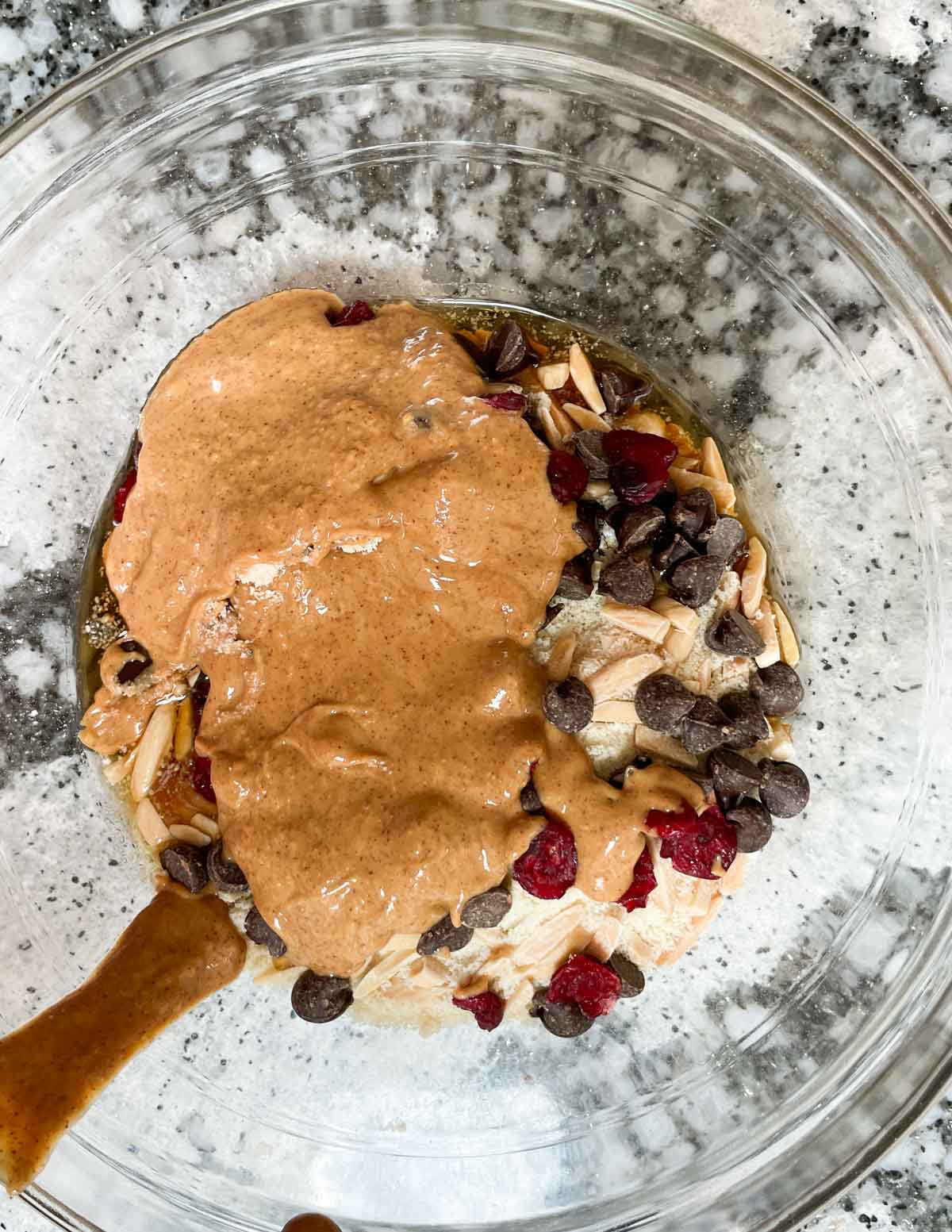 Almond Butter added to bowl of dry ingredients.
