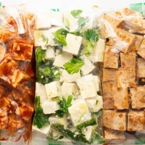 Tofu in baggies marinating in different sauces.