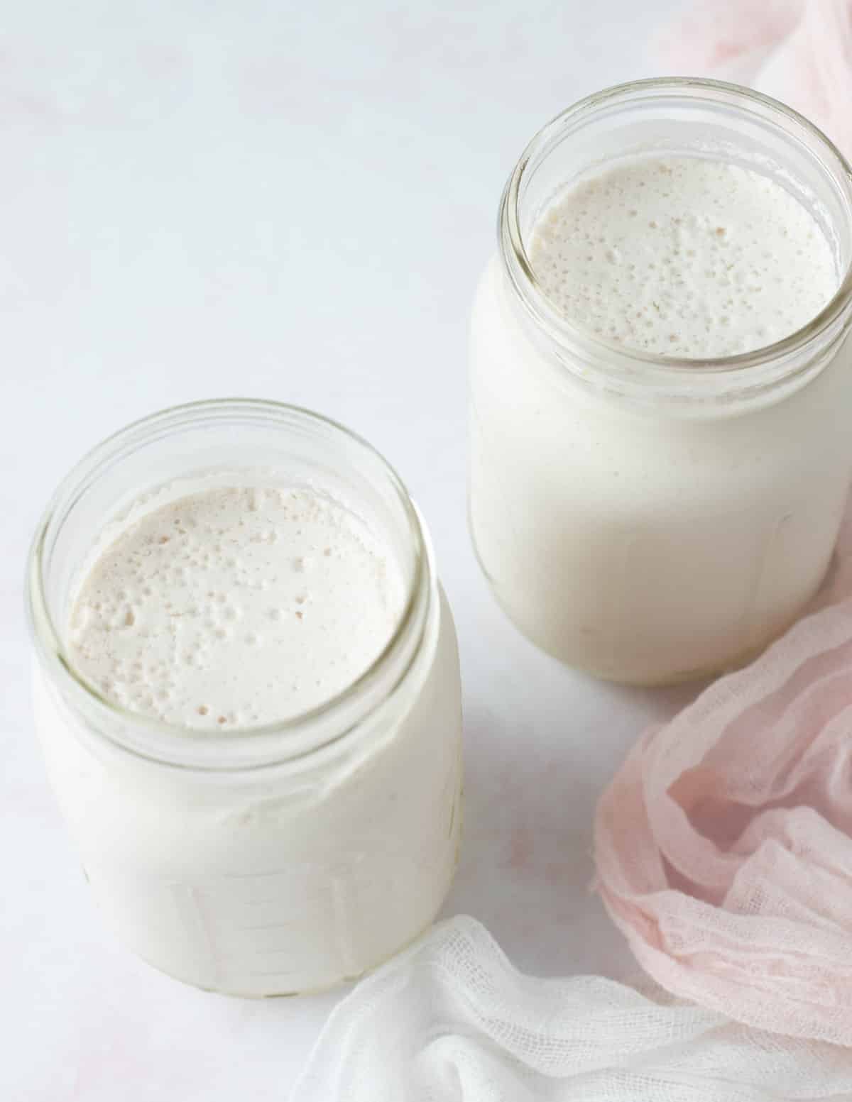 Almond milk yogurt in two mason jars.
