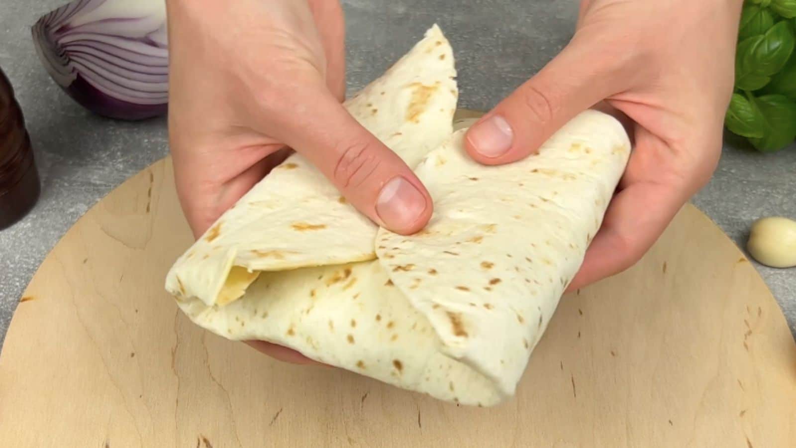Wrapping burrito up. 