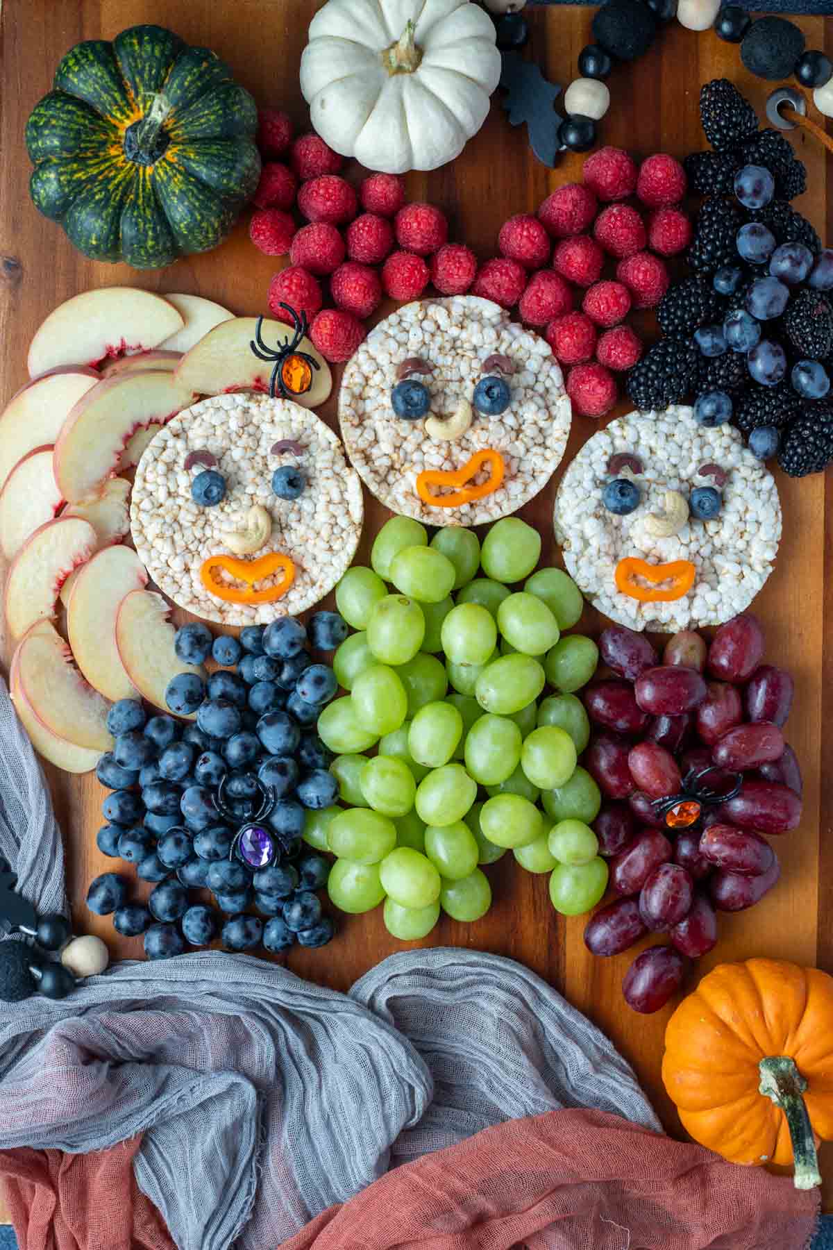 Hocus Pocus snack board made with fruit and rice cakes.
