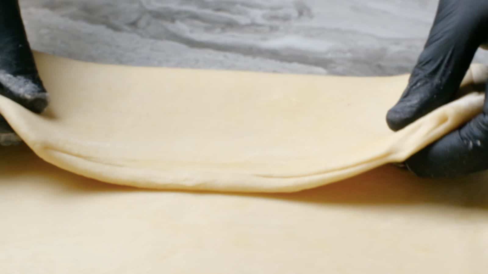 Folding puff pastry dough.

