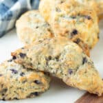 Vegan blueberry scones on a white marble serving platter.