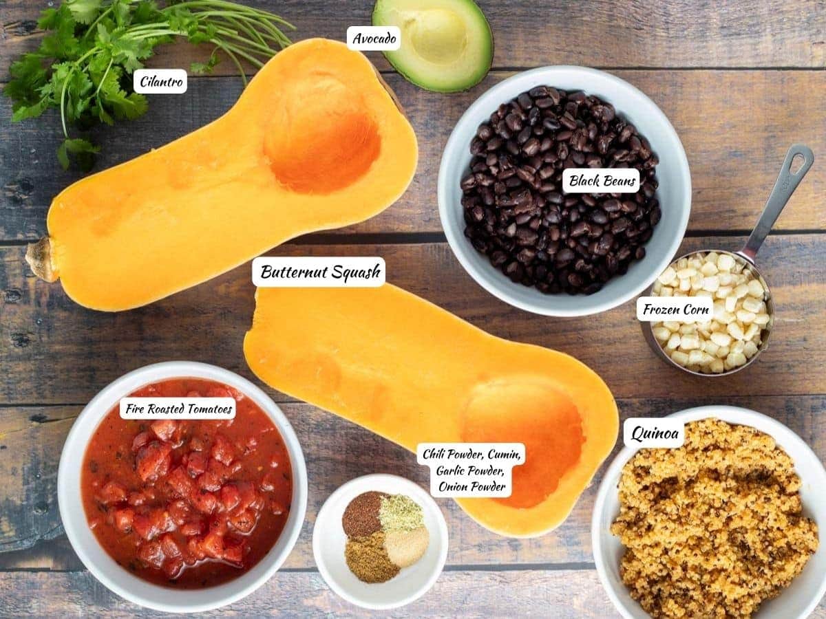 Vegan stuffed butternut squash ingredients: cilantro, avocado, butternut squash, black beans, corn, quinoa, chili powder, cumin, garlic powder, onion powder, and fire roasted tomatoes.