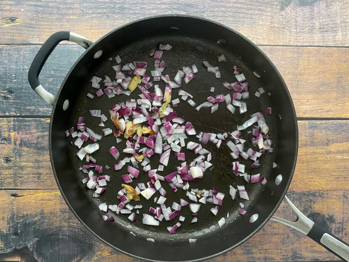 Diced onion and garlic in a saute pan.
