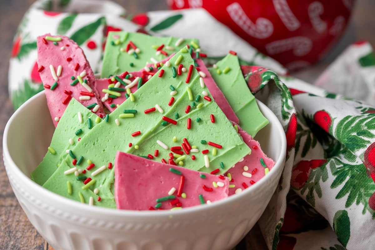 Green and red chocolate bark topped with Christmas sprinkles.