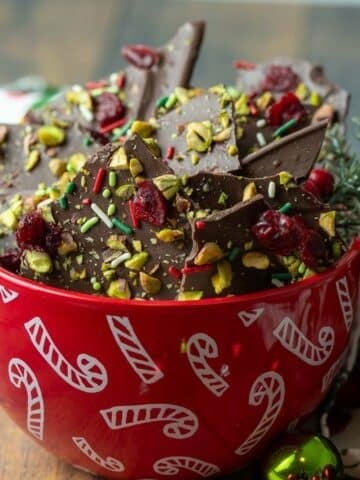 Christmas chocolate bark topped with pistachios, cranberries, and sprinkles.
