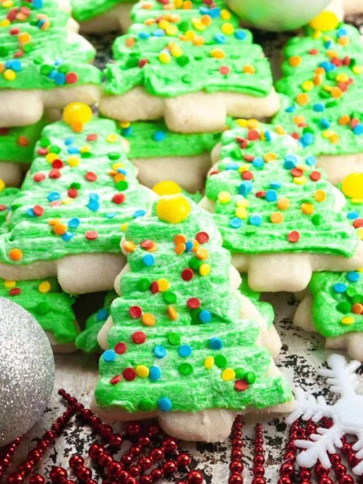Cut out Christmas tree sugar cookies.