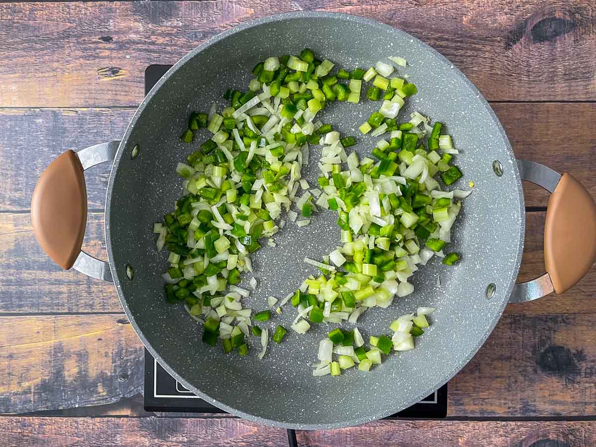 Onions, garlic, celery, and green pepper in saute pan.