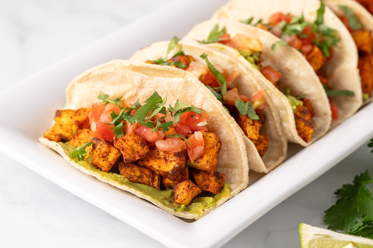 Vegan sweet potato tacos on a serving platter.