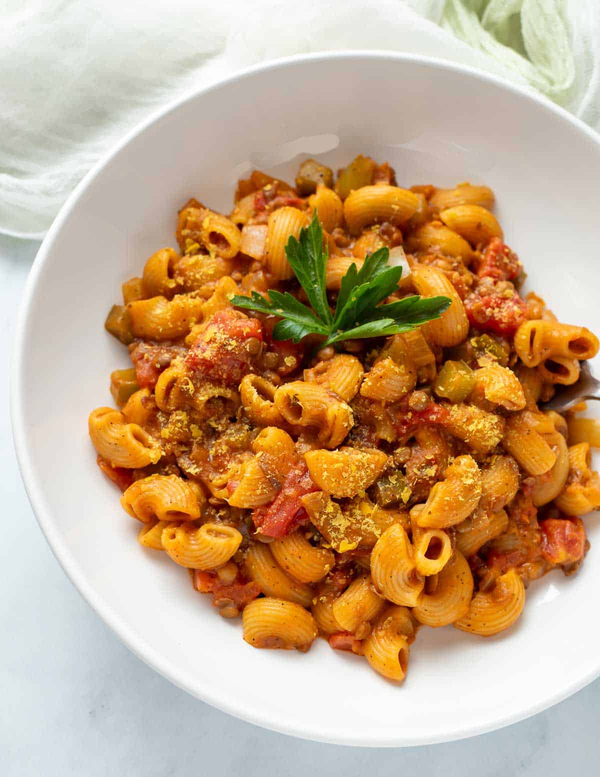 Vegan hamburger helper in a white bowl.