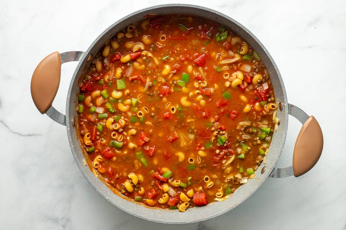 Vegan hamburger helper ingredients in pot.