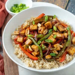 Kung pao tofu in white serving bowl.
