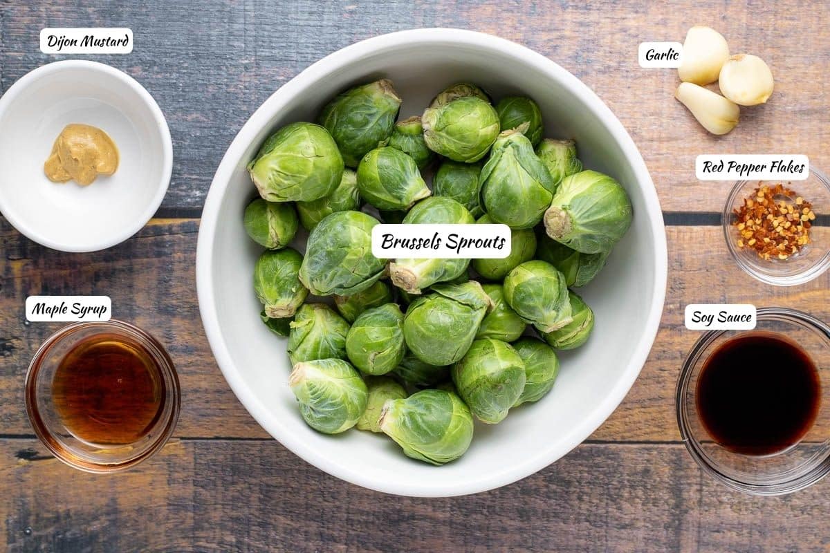 Soy glazed brussels sprout ingredients: dijon mustard, maple syrup, brussels sprouts, garlic, red pepper flakes, soy sauce.