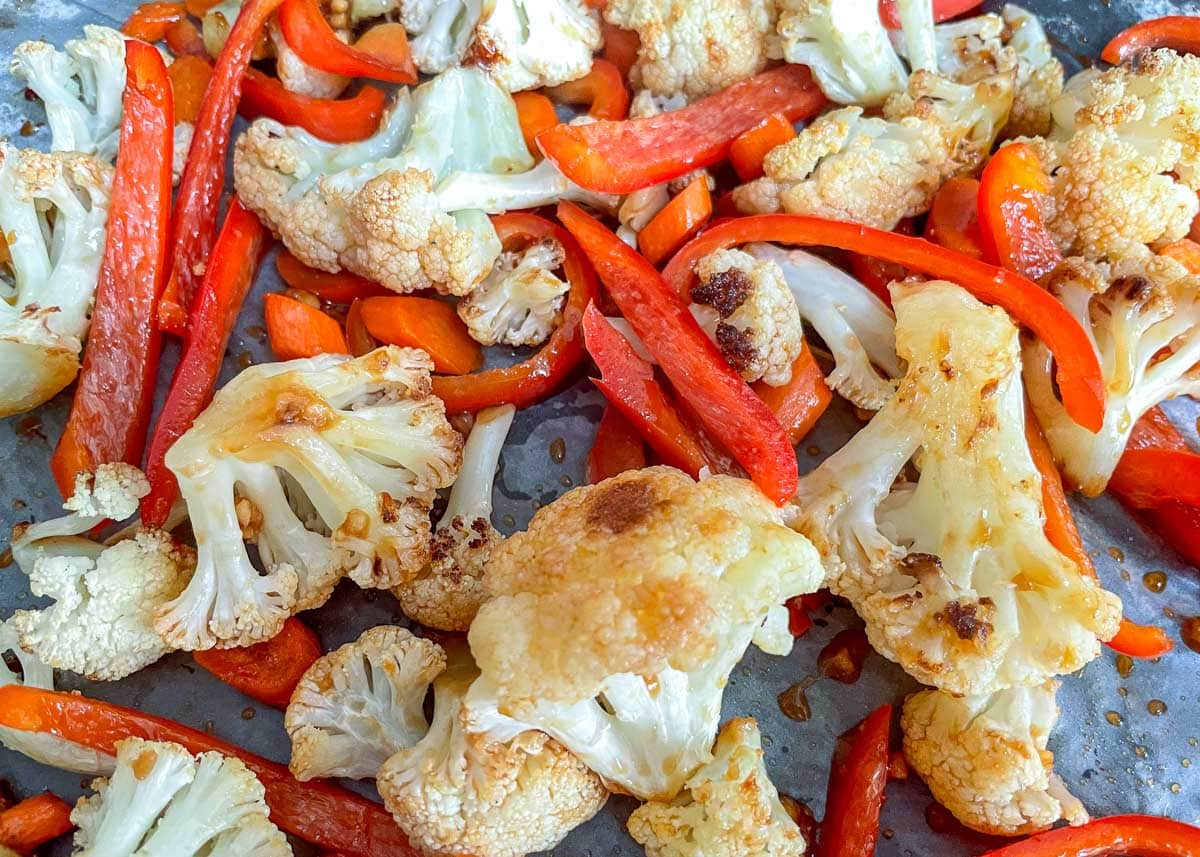 Roasted cauliflower, carrots, and red peppers coated in teriyaki.