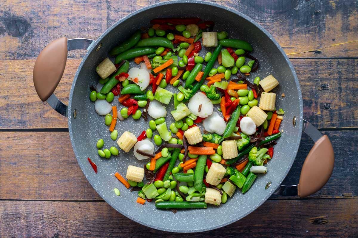Stir-fried vegetables in saute pan.