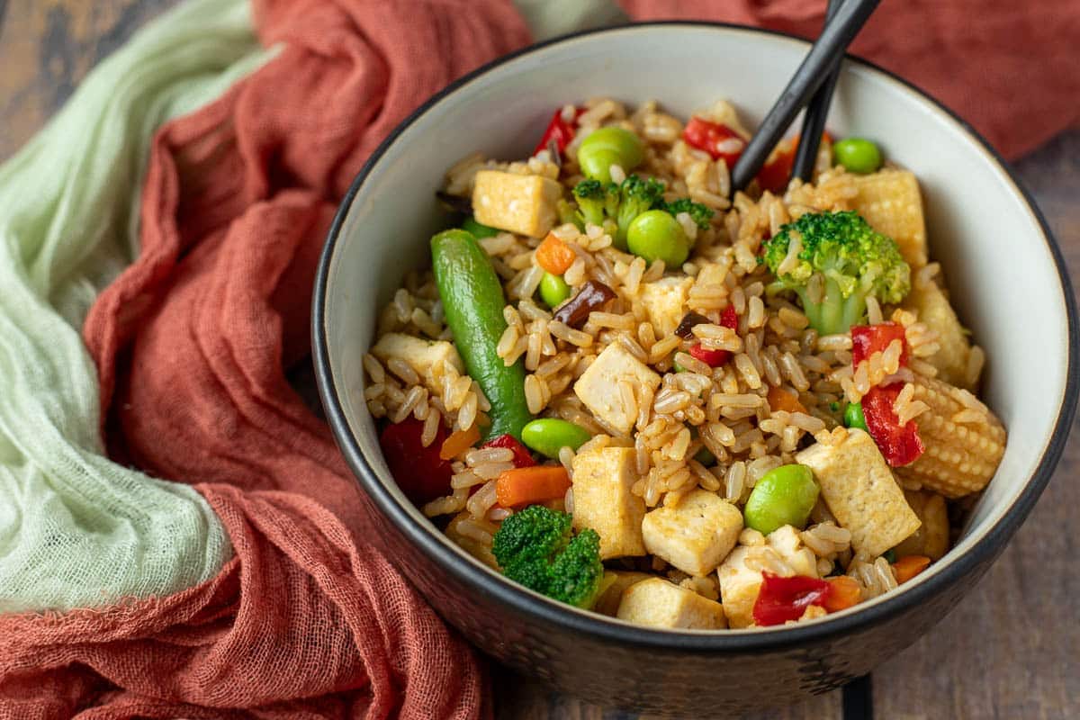Bowl of vegan stir-fried rice. 