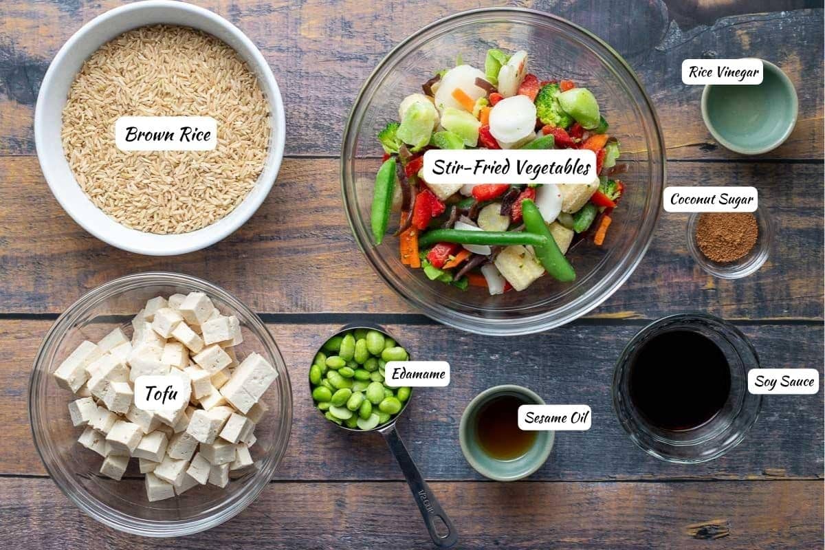 Vegan Fried Rice Ingredients: brown rice, stir-fried vegetables, rice vinegar, coconut sugar, soy sauce, sesame oil, edamame, tofu.