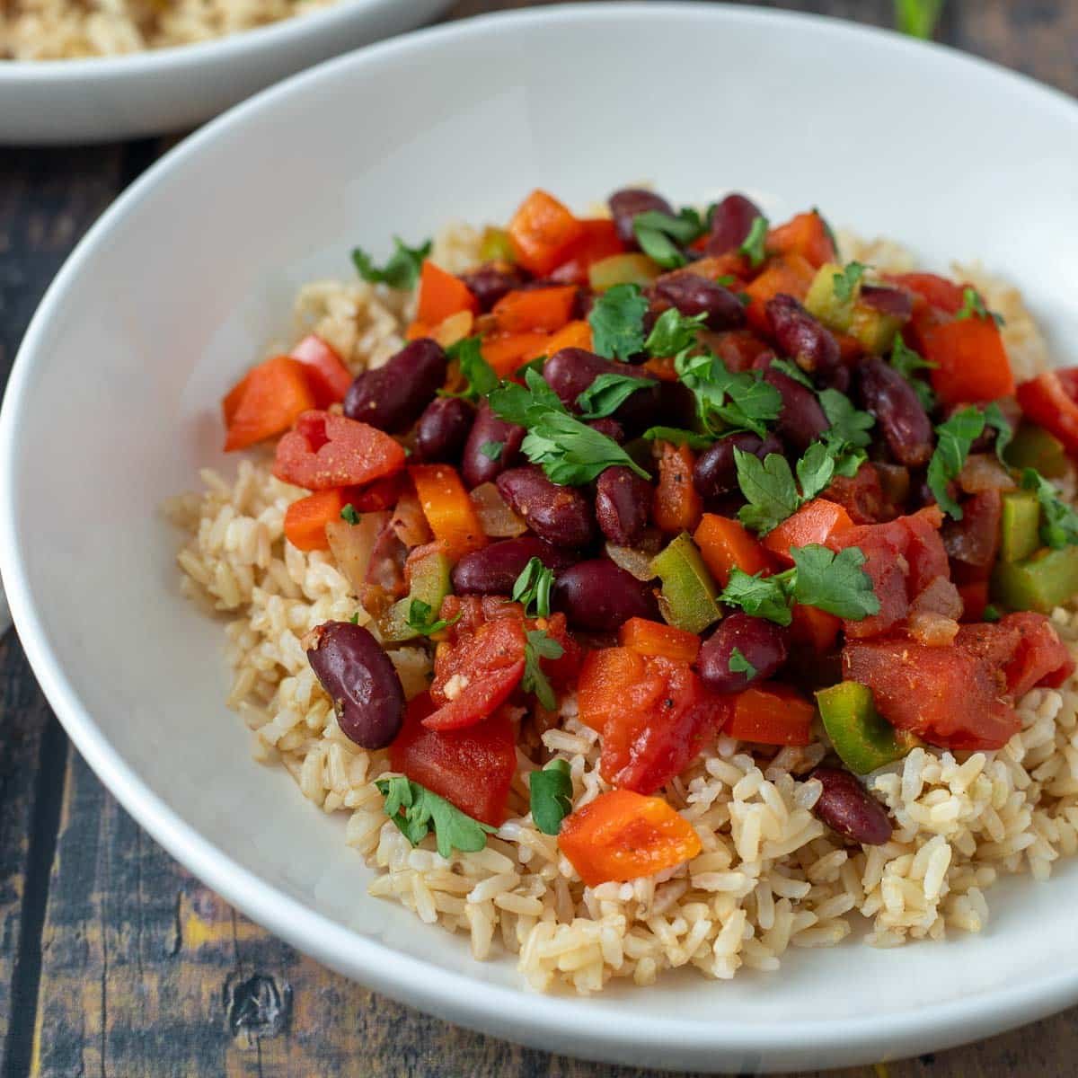 Vegan red beans and rice in a white bowl.