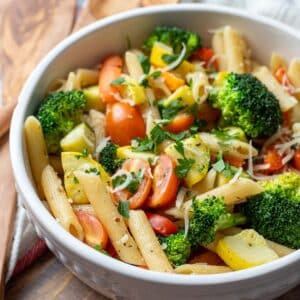 Vegan pasta primavera in serving bowl.