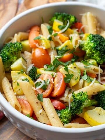 Vegan pasta primavera in serving bowl.
