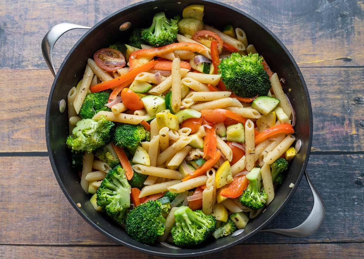 Pasta primavera tossed together in large pot.