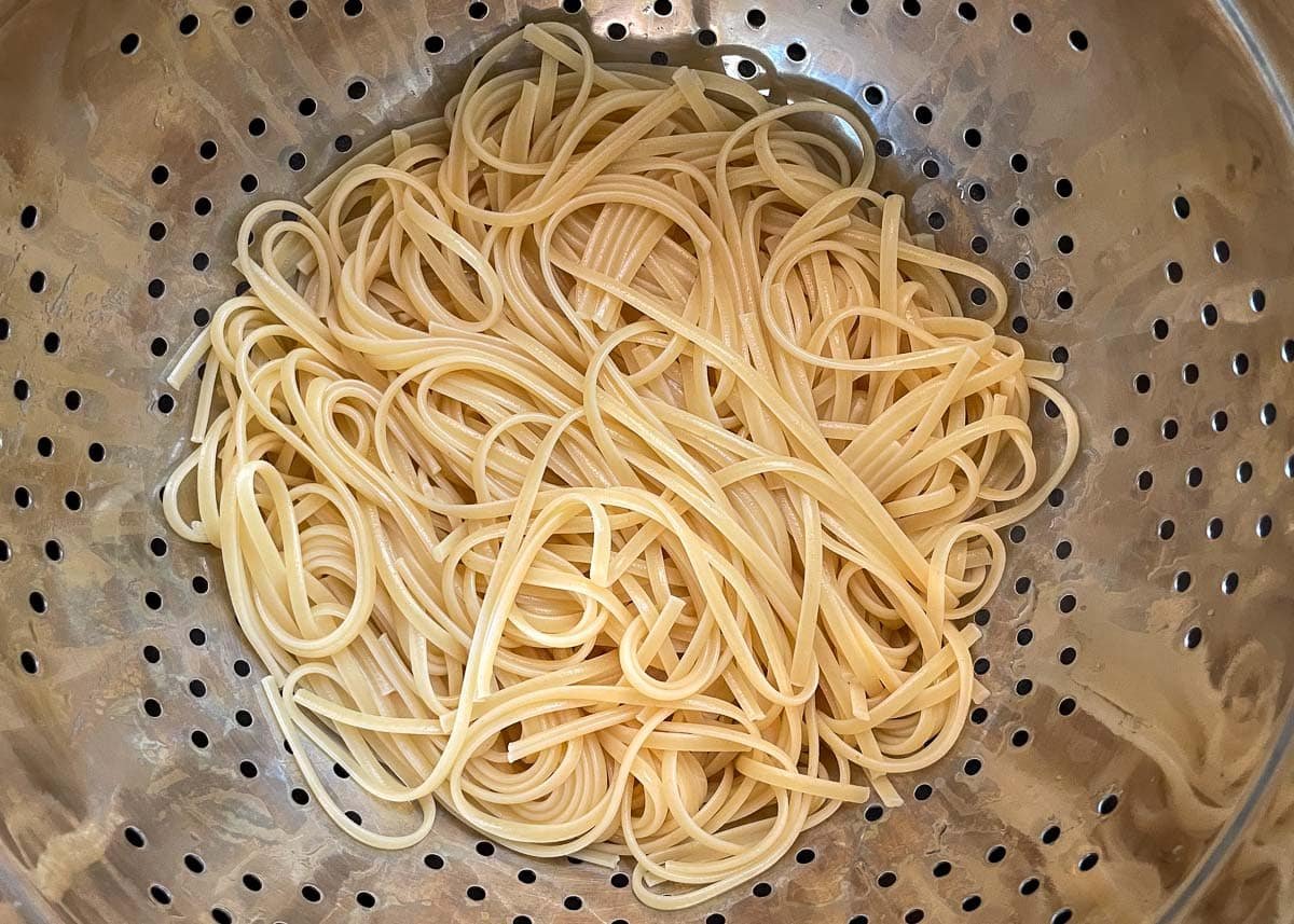 Spaghetti in colander.