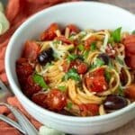 Bowl of vegan pasta puttanesca.