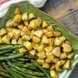 Platter with roasted potatoes and green beans.