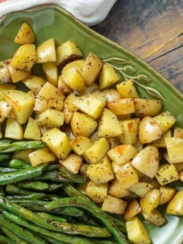 Platter with roasted potatoes and green beans.