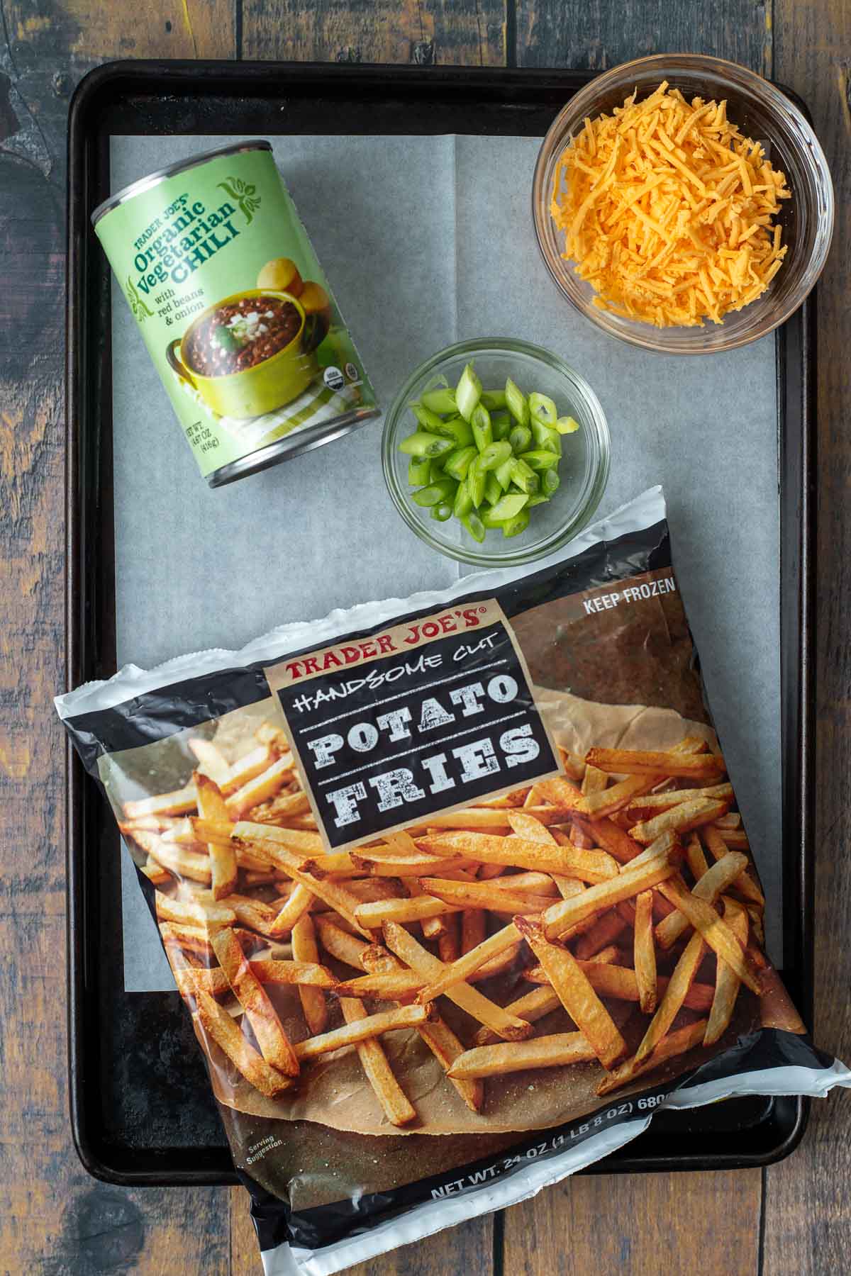 Vegan Dirty Fries Ingredients: 1 can of organic vegetarian chili, small bowl of vegan cheddar shreds, small bowl of scallions, and a bag of potato fries.