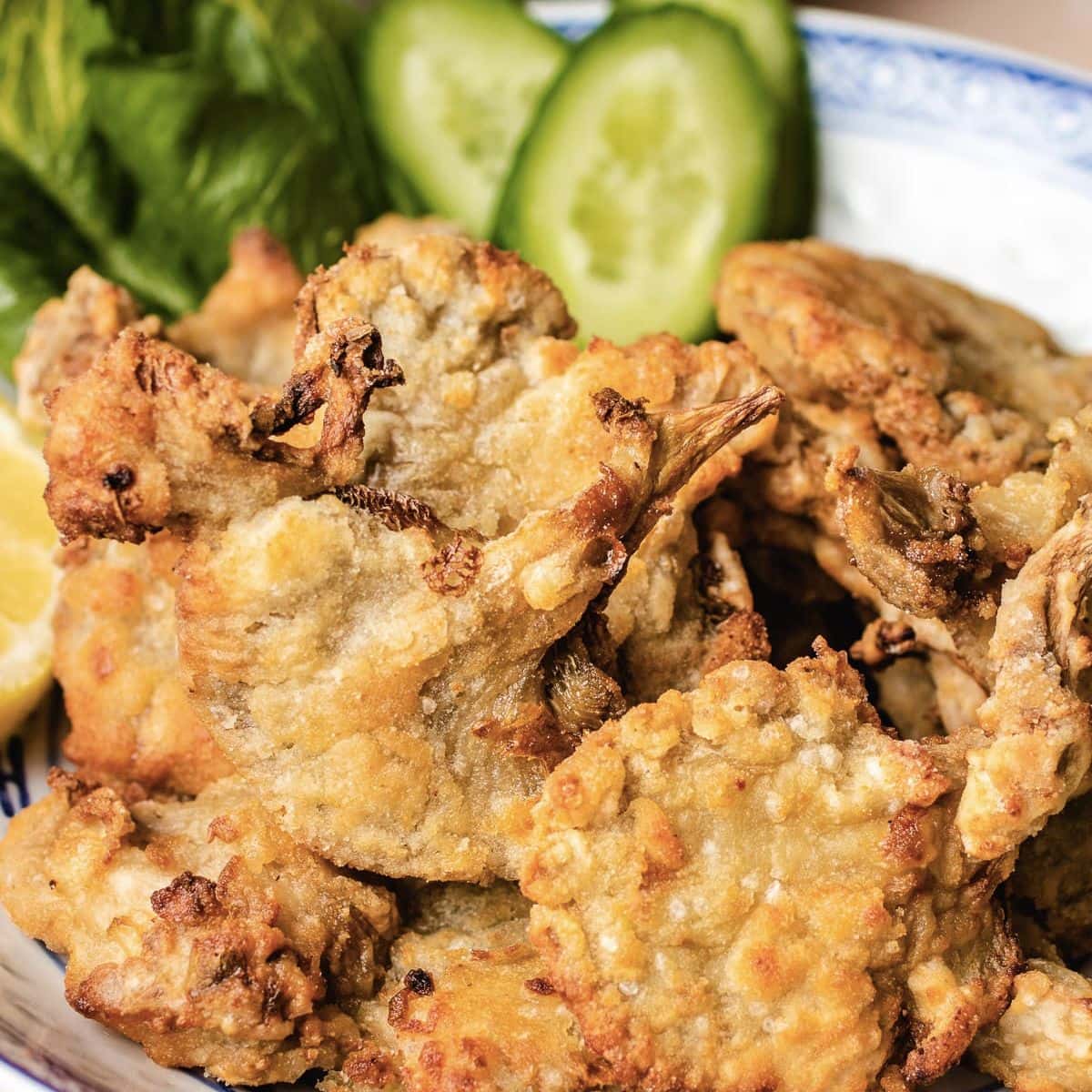 Battered oyster mushrooms in a bowl.