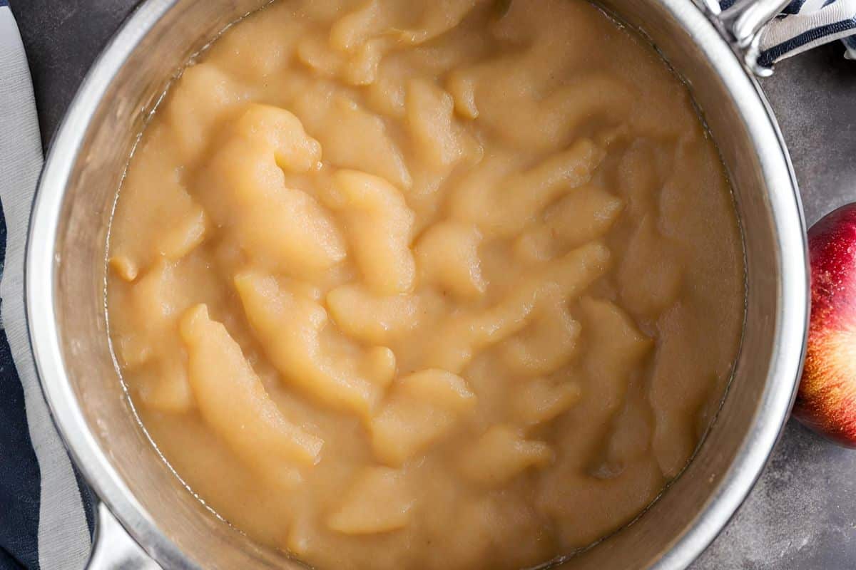 Cooked applesauce on stovetop.