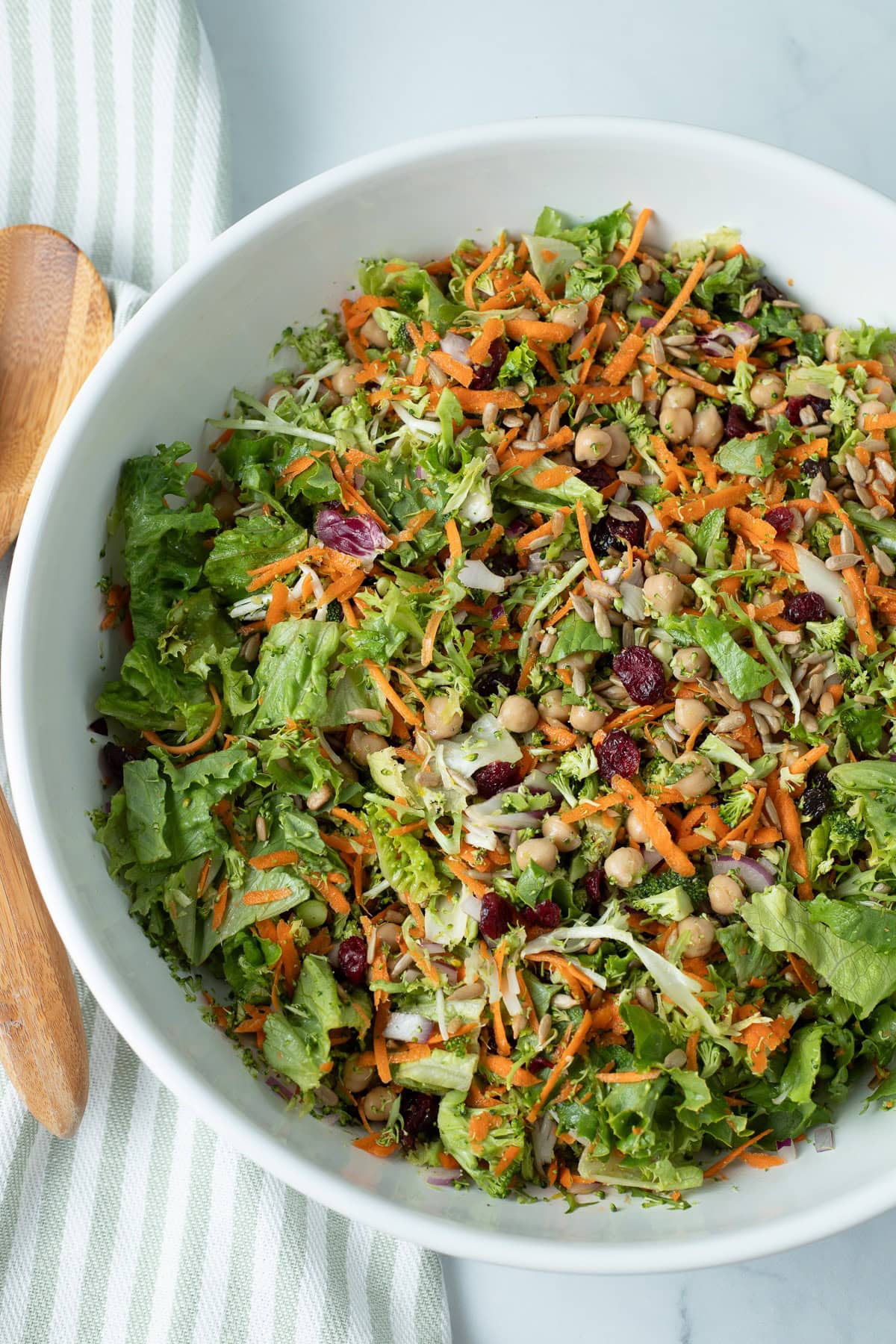 Broccoli crunch salad in a large white salad bowl.