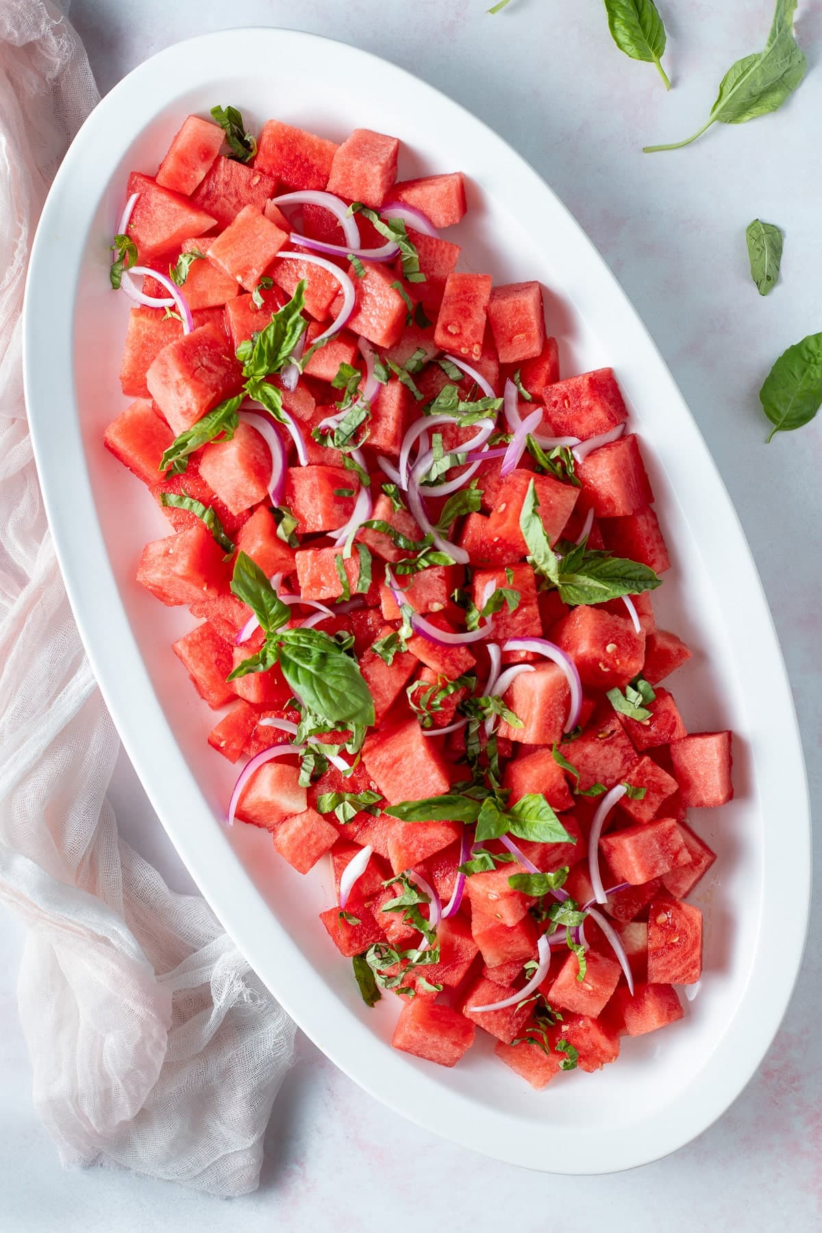 Watermelon basil salad on a platter.