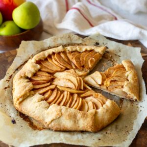 Vegan apple galette on parchment paper.
