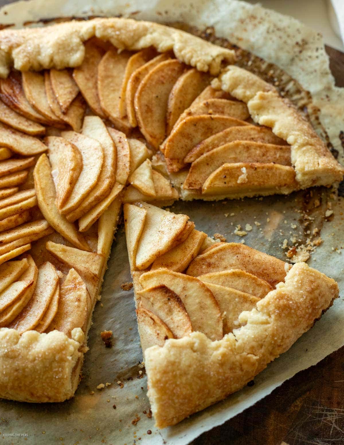 Vegan apple galette on parchment paper.