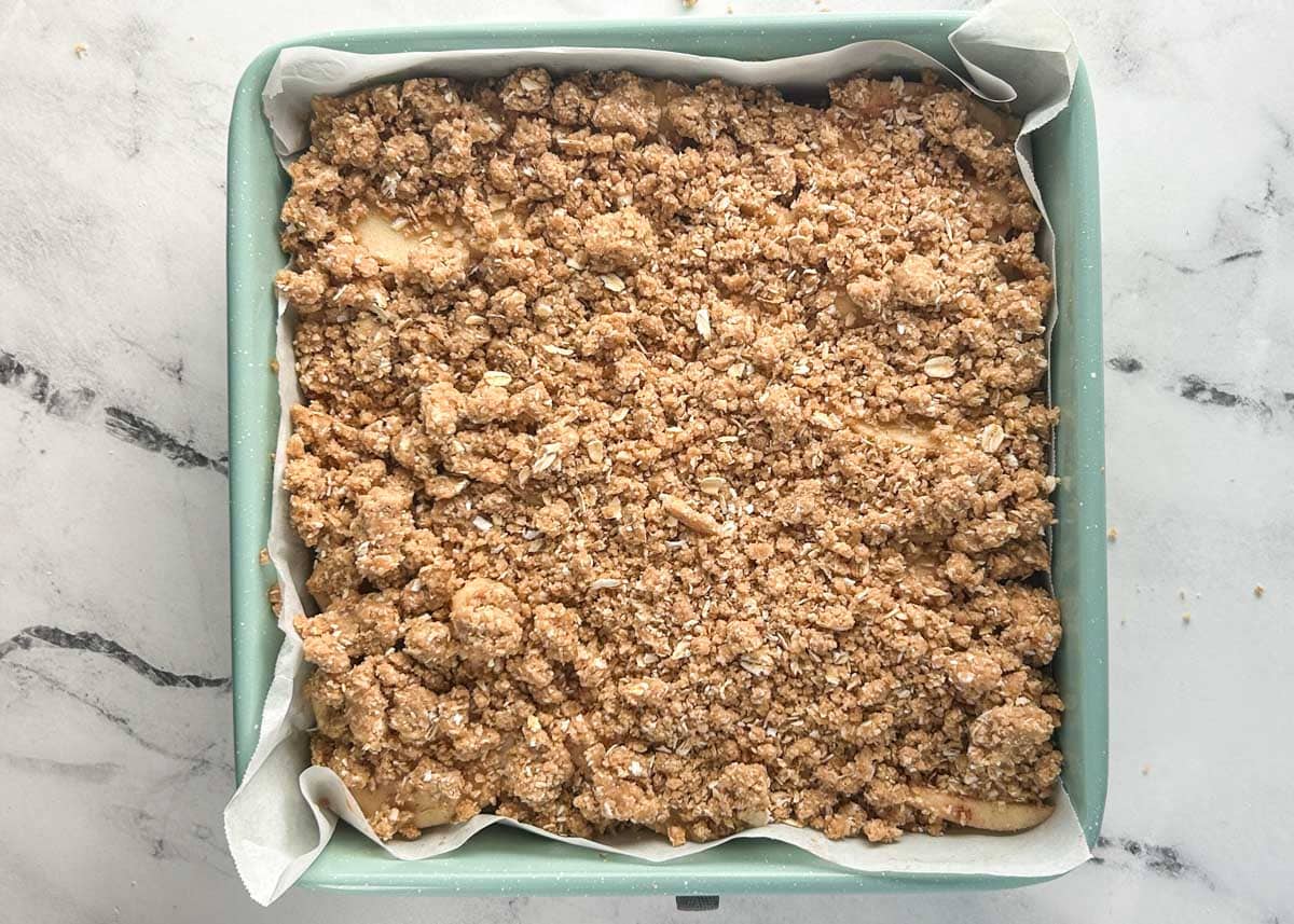 Vegan apple streusel bars in baking dish.