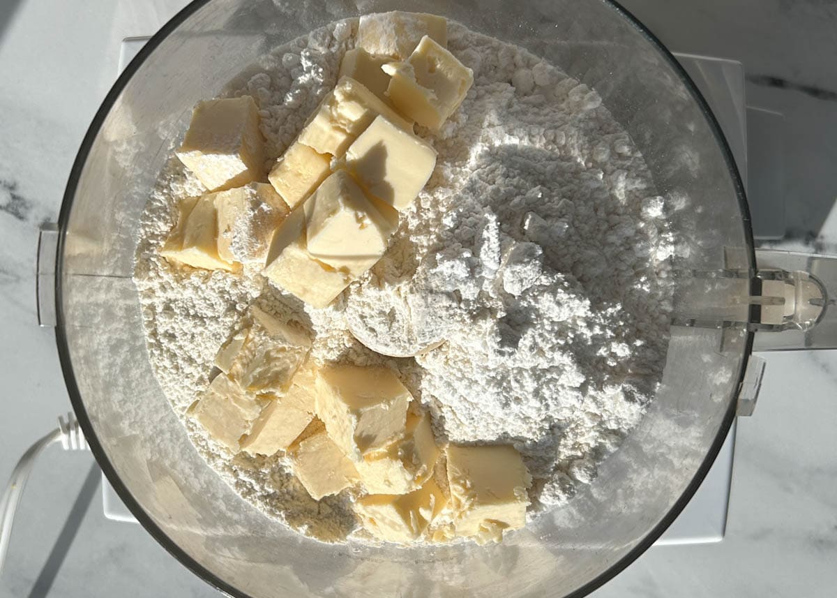 Flour, powdered sugar, vegan butter in food processor.