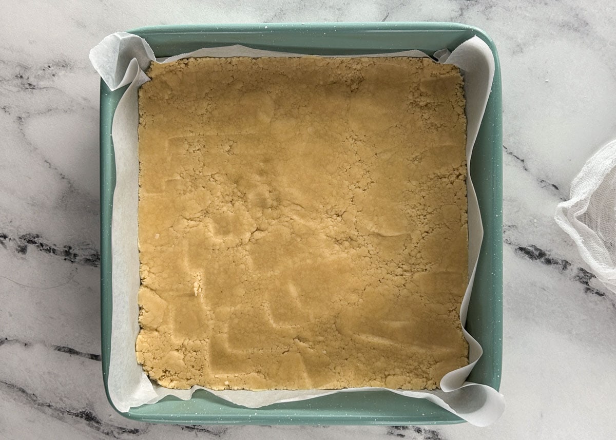 Shortbread crust in 9x9 baking pan.