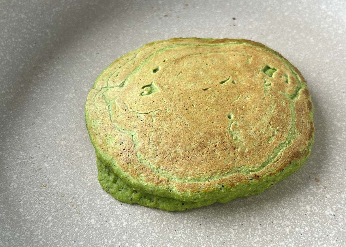 Spinach pancake on pan.